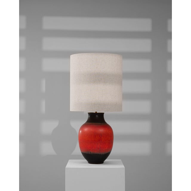 This 20th-century German ceramic table lamp stands out with its bold, vibrant glaze that transitions seamlessly from deep...