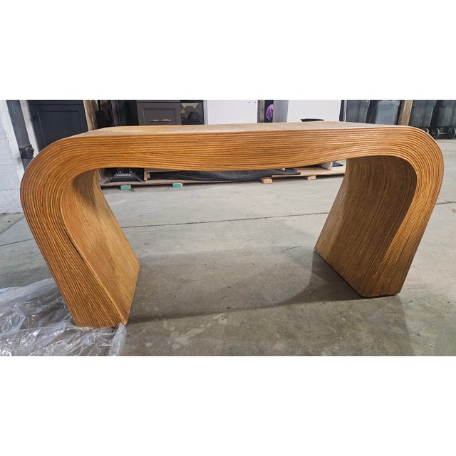 This item is a Pencil Reed Waterfall Console Table, a popular style of vintage furniture, often attributed to the Italian...