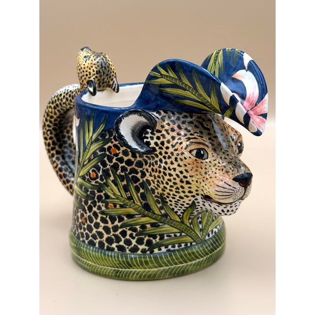 A hand-painted leopard-form mug by Ardmore Ceramics, South Africa, dated May 2019. This sculptural vessel is modeled and...