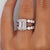 A breathtaking 5.55-carat emerald-cut lab diamond takes center stage in this unique platinum engagement ring, accented by...