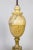 A sizable urn lamp in a marble complex in grain and amber color. Mounted on original, gilded base. Newly rewired with a...