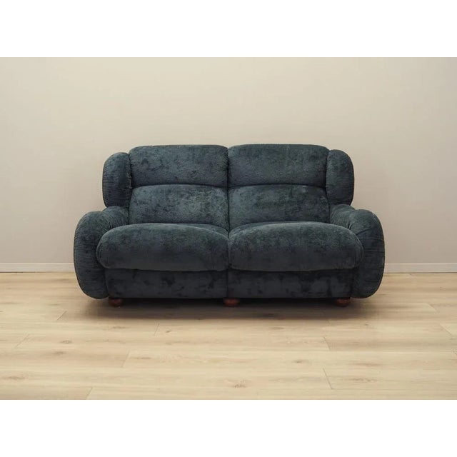 The sofa was made in the 1970s, Italian production. The legs are made of solid wood. The sofa has retained its original...
