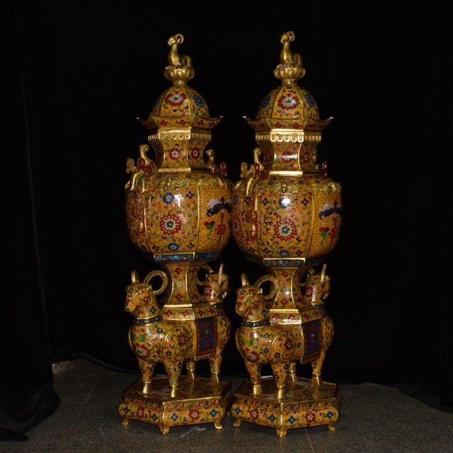 This monumental pair of Chinese cloisonne enamel vessels is a spectacular statement piece for collectors or high-end...