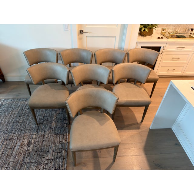 An exceptional, custom-tailored set of eight modern "Gondola" style dining chairs by renowned luxury furniture...
