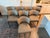 An exceptional, custom-tailored set of eight modern "Gondola" style dining chairs by renowned luxury furniture...