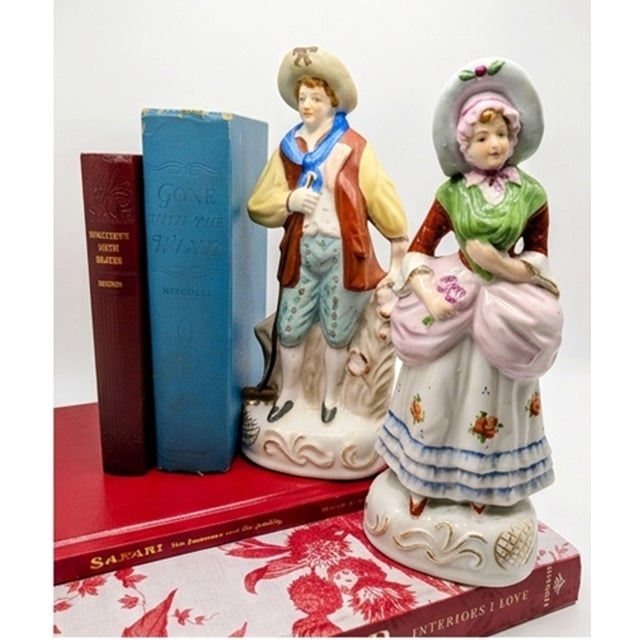 Charming pair of vintage porcelain figurines marked “Made in Occupied Japan,” dating the pieces to the American occupation...