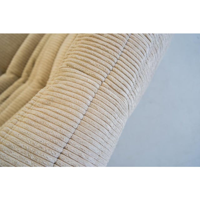 This Togo has been reupholstered with new foam and high-quality new fabric, keeping its inner structure giving the item...