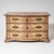 Large Baroque commode with a gently serpentine front and brass mounts. The piece is fitted with three drawers. The commode...