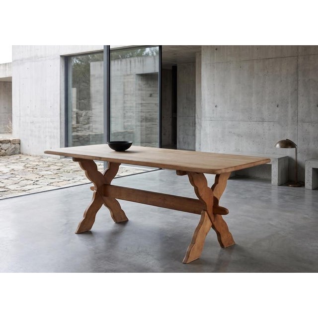 Rectangular dining table in solid oak, attributed to Danish designer Henning Kjærnulf and produced in Denmark during the...