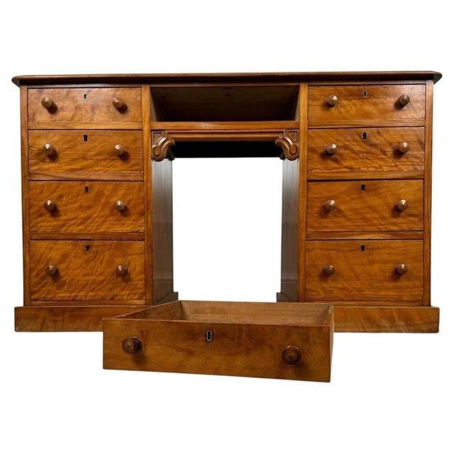 A fine 19th-century English writing desk, beautifully crafted from satinwood and distinguished by its warm golden colour,...
