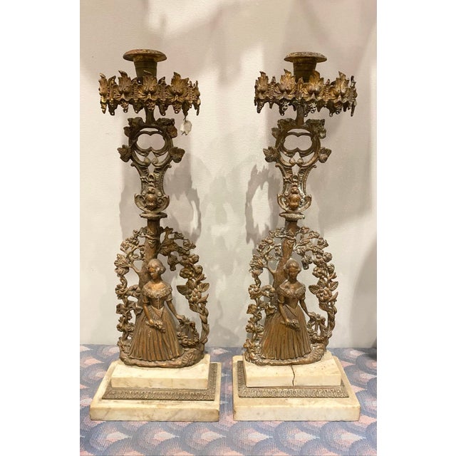 18” tall 5” wide Good condition Exquisitely cast, these single-light candlesticks feature a romantic "Lady under a...