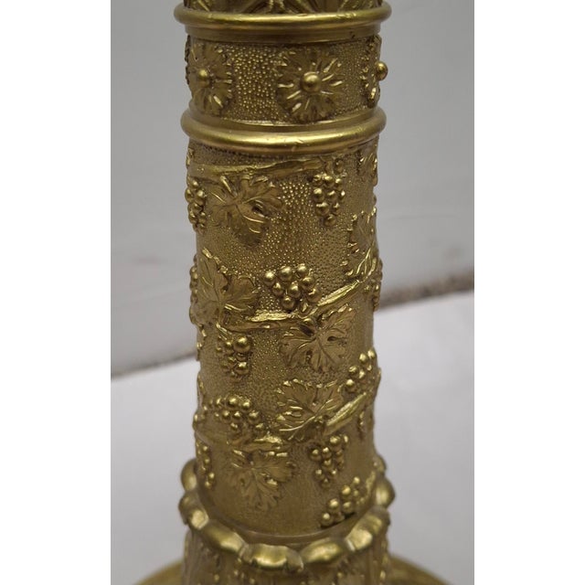 A Pair of French Regency Charles X intricately Etched / chiseled Gilt Bronze Candlestick Lamps Mounted as lamps. This...