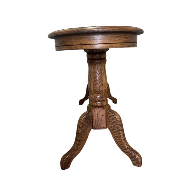 This vintage coffee table by Eastman House Furniture features solid oak construction and classic refectory-style...