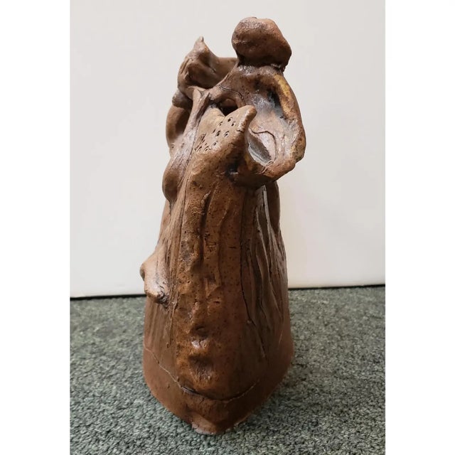 This is an Eva Bouzard-Hui Art Pottery Nude Women and Cat Clay Sculpture. It measures 8 1/2" tall, 8 3/8" wide, and 4 1/8"...