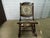 This vintage antique tapestry carved wood folding rocker rocking chair from the Victorian era is a unique and elegant...