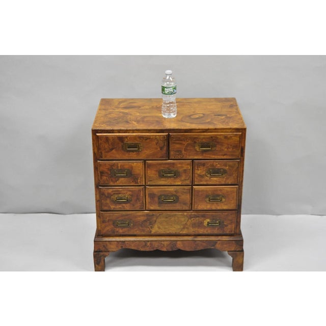Vintage Italian Olive Wood Veneer Campaign Chest of 9 Drawers with Inset Brass Pulls. Circa Mid 20th Century....