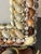 Beautiful elegant design sea shell encrusted photo frame in tan and brown natural colored shells in Tony Doucquett style.
