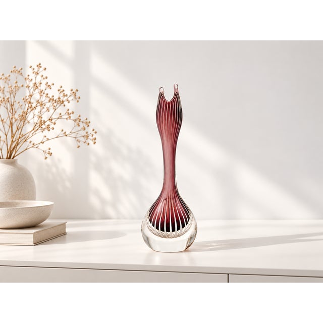 Elegant zebra-striped glass vase by Vicke Lindstrand for Kosta, Sweden. The distinctive design, featuring free-flowing red...