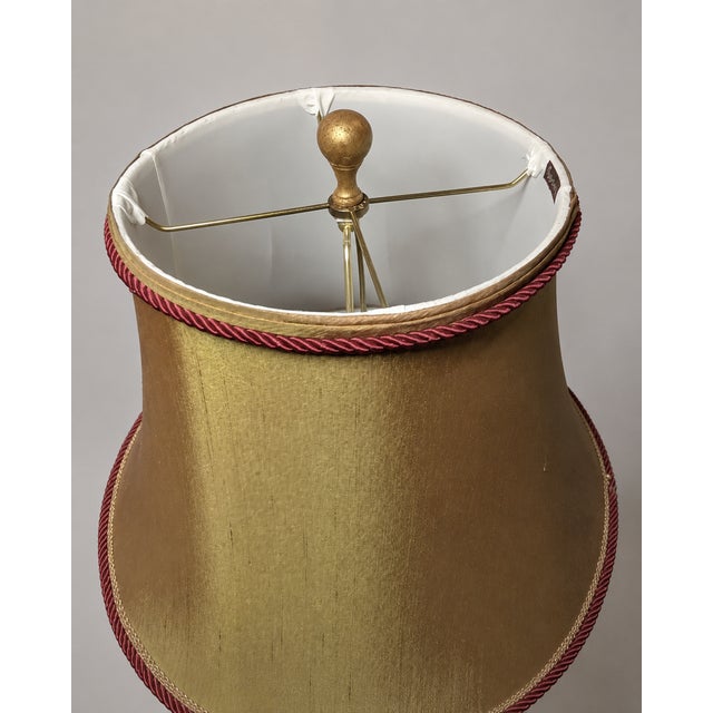 Bold matched pair of vintage Frederick Cooper table lamps dating to the 1970s, featuring rich ruby-red glazed porcelain...