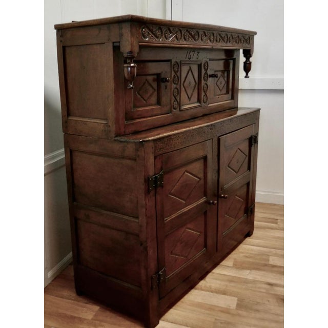 Antique Court Cupboard in Carved Oak, 1673 For Sale - Image 12 of 14