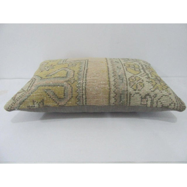Decorative pillow cover made from a vintage Turkish handknotted rug. Backed with good quality cotton fabric. Pillow...