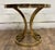 This is an absolutely stunning vintage Hollywood Regency or Art Deco tulip or Milo Baughman style brass and glass side...
