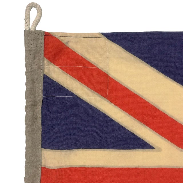 This large vintage flag of New Zealand is made from a coarse woolen cloth in vibrant orange-red, off-white and faded blue....