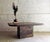 This brutalist coffee table, made of slate/natural stone and delicate brass elements, dates from the 1970s and perfectly...