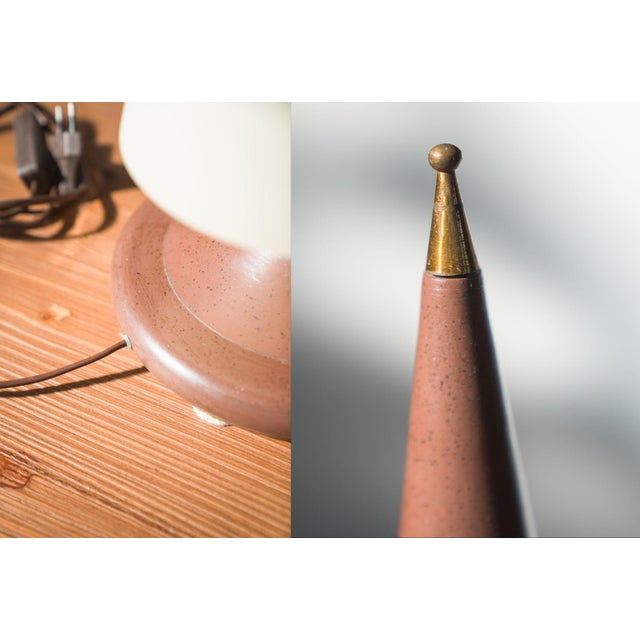 1970s-80s Brass and Glass Table Lamp This elegant table lamp from the 1970s-80s embodies a sleek, mid-century modern...