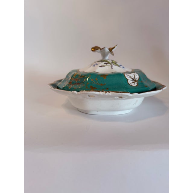 A striking example of mid-19th century French tableware, this elegant covered entrée dish is crafted in fine Old Paris...