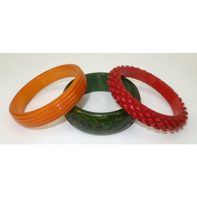 Chunky & Chic! Collection of 1940's carved plastic bangle bracelets that have the look of bakelite in a trio of autumnal...