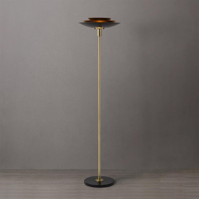 The Rancho Mirage Torchiere Floor Lamp, a beacon of elegance and sophistication that adds a touch of vintage-inspired...