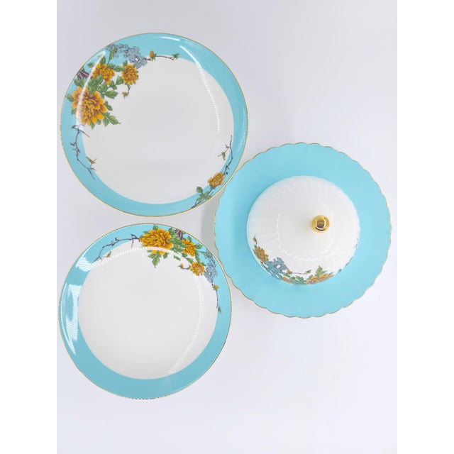 Elevated, collectible, and beautifully detailed, this three-piece Bone China serving set brings refined artistry to your...