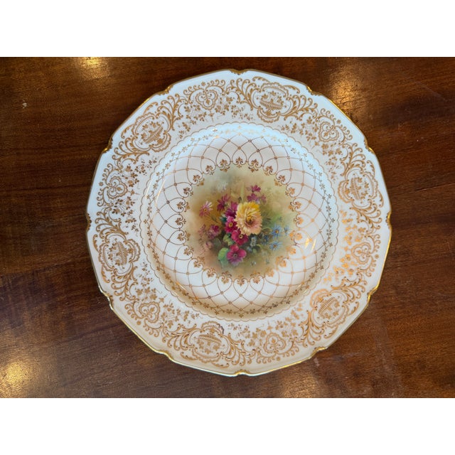 Rare set of two E.Perry Royal Doulton Cabinet Plates. They are heavily gilded scrollwork, raised gold with hanging floral...