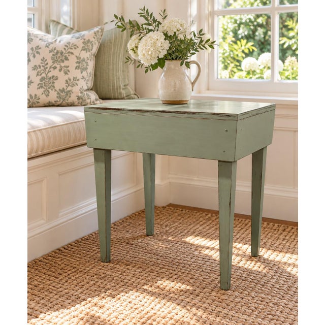 Charming primitive farmhouse table finished in a soft sage green with lightly distressed edges that reveal the natural...