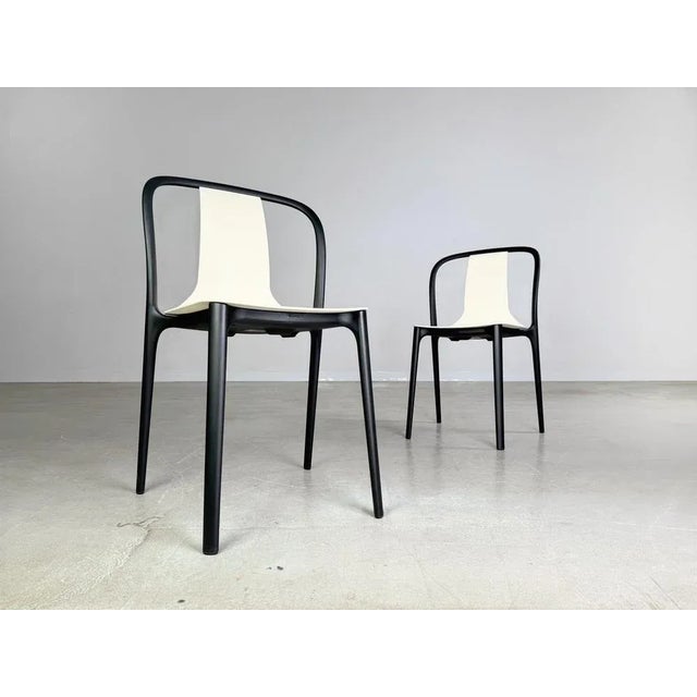 Set of 2 Vitra Belleville stacking chairs in the color cream for sale. The chairs are made entirely of plastic and are...