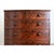 A classic English bowfront chest of drawers made of mahogany in the Regency style, circa 1870. The top surface is a large...