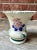 Antique almost 100 year old handpainted art deco pottery vase. Handpainted flowers. Stamped on bottom with makers mark.