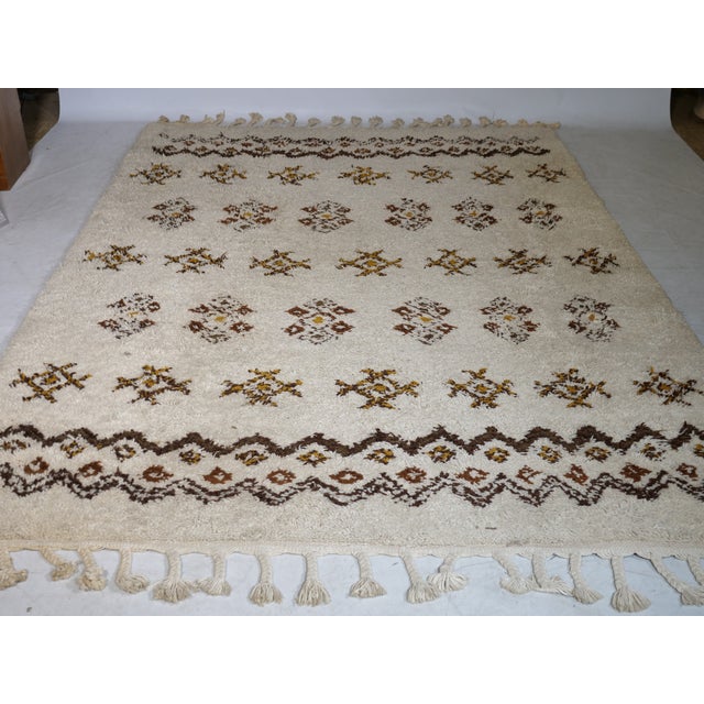 Hand-knotted Berber wool rug from Morocco, 1978. The rug is made of pure new wool and features a classic geometric pattern...