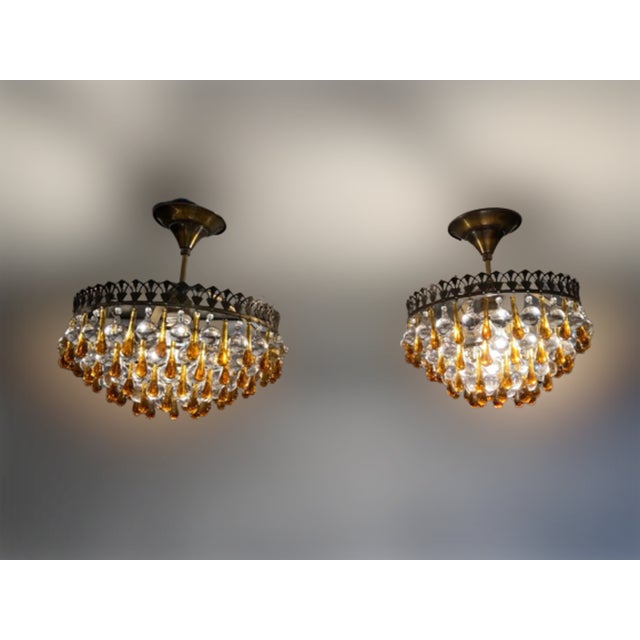 Pair of vintage Murano glass lamps from the 1950s. Ceiling-mounted ceiling light style. Patinated brass crown. Transparent...