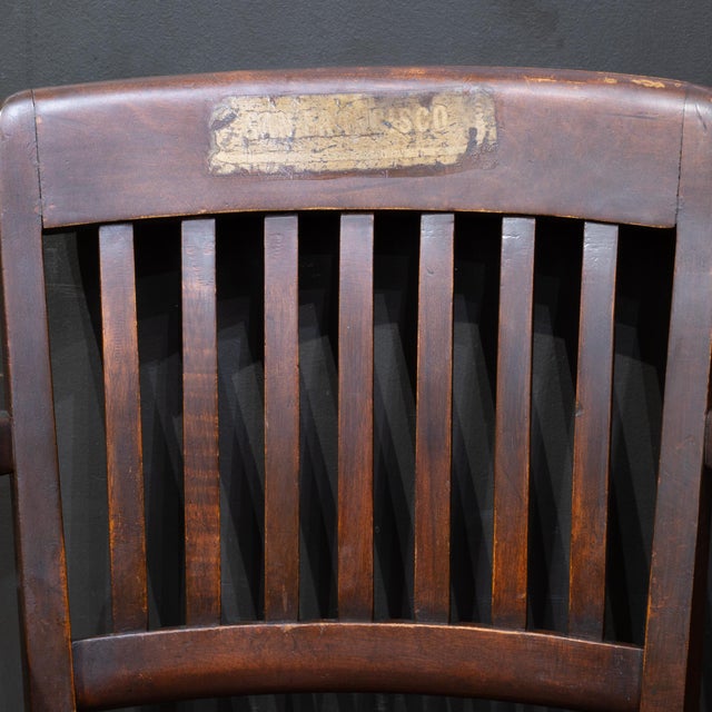 ABOUT Antique solid oak adjustable swivel banker's or library desk chair in a mahogany finish featuring a classic vertical...