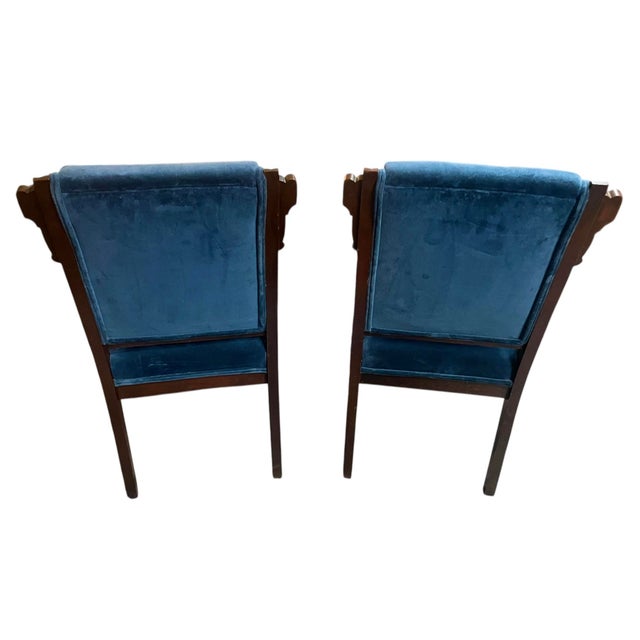 Pair of Antique Eastlake Victorian Parlor Chairs From the 19th Century -The chairs are made of walnut with characteristic...