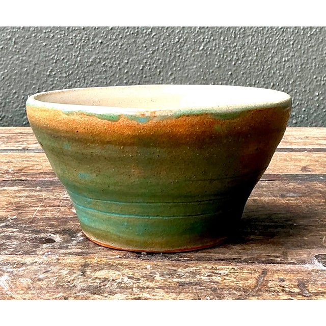 This beautifully crafted vintage studio pottery bowl exemplifies the quiet sophistication of mid-century artisan ceramics....