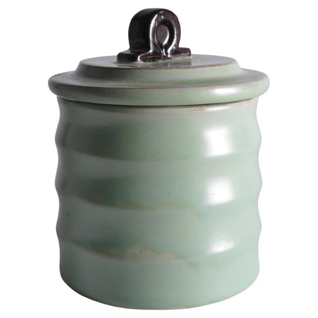 A refined Art Deco lidded jar designed by Einar Luterkort and produced by Upsala‑Ekeby between 1932 and 1938. This elegant...