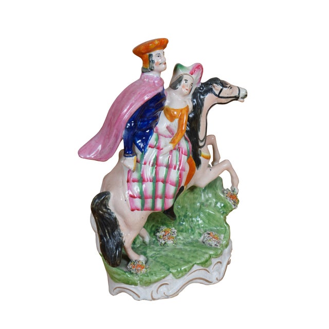 Antique 19th century Staffordshire porcelain flatback figurine depicting Saint George and the Princess in bright clothing...