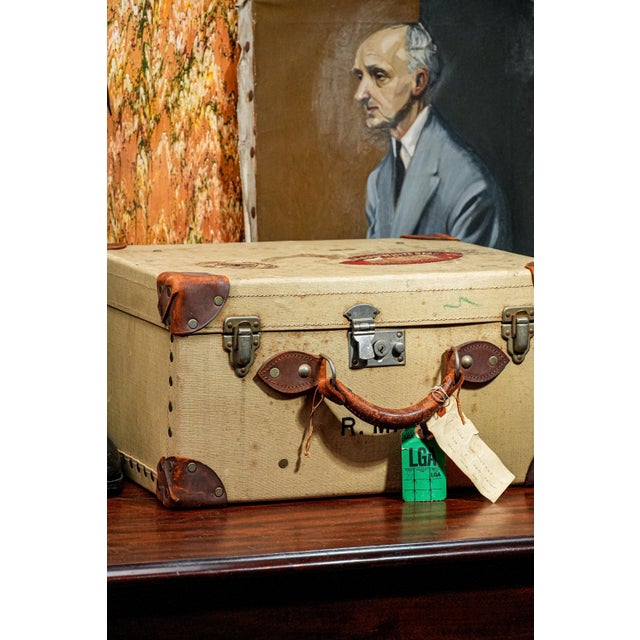 Add a touch of transatlantic charm to your decor with this evocative vintage English travel case, a beautifully worn...