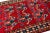 This stunning, antique-style Shiraz wool rug features intricate hand-knotting and a vibrant red base. The rug showcases a...