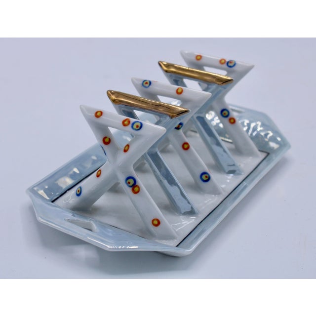 A superb vintage ceramic Art Deco style toast rack / letter holder. This unique letter rack has 4 slots for plenty of...