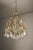 A grand Empire-style chandelier dating to the mid-20th century, characterized by its open "birdcage" structure and...