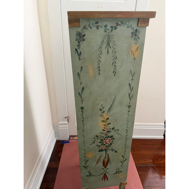 Vintage tall painted cabinet / chest in mottled, sage green finish (faux finished). Conntinuous painted floral design...